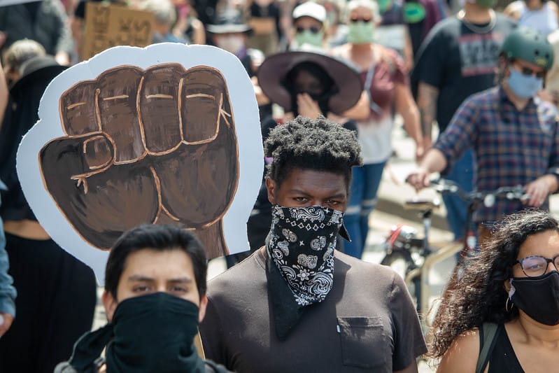 Black Lives Matter protest where everyone in the photo is wearing a mask.
